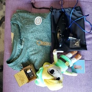 Lot of The Legend of Zelda merchandise: T shirt, Ocarina, Triforce pin, Music Bo